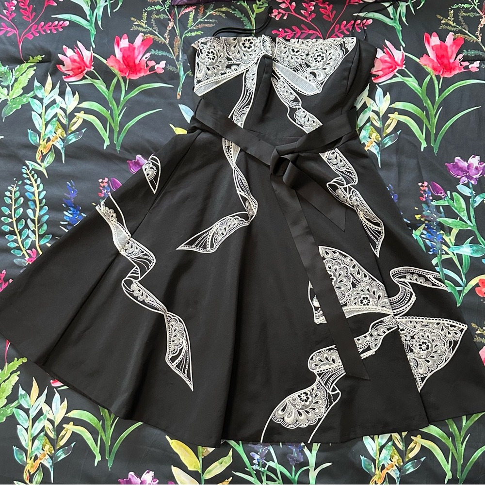 Black dress with white detailed embroidery